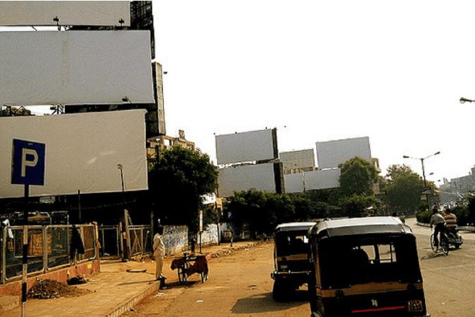 A photograph of empty advertising hoardings in Ahmedabad